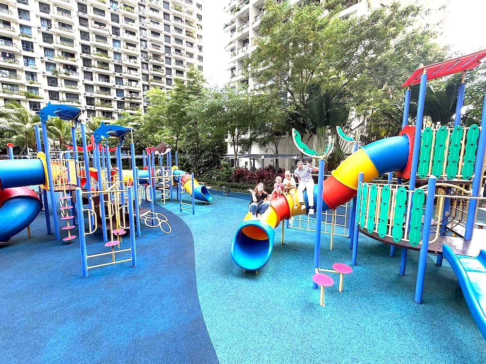 A colorful playground among the towers and palm trees of Forest City